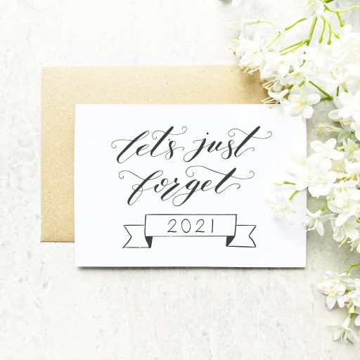 LETS-JUST-FORGET-2021-GREETING-CARD-FRONT-FLATLAY